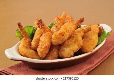 Deep Fried Breaded Butterfly Shrimp Served On A Bed Of Lettuce