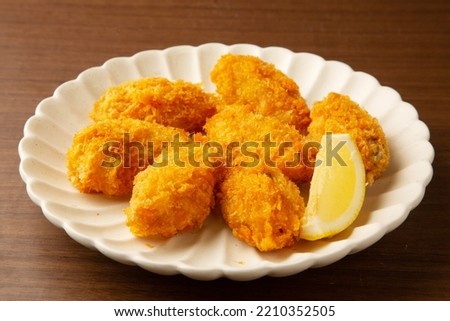 Deep fried breaded oyster served on a plate