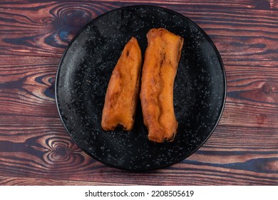 Deep Fried Brinjal Pakora Or Beguni Served In A Dish Isolated On Background Top View Of Indian And Bengali Food