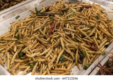 Deep fried caterpillars worms. Famous snack in Thailand.