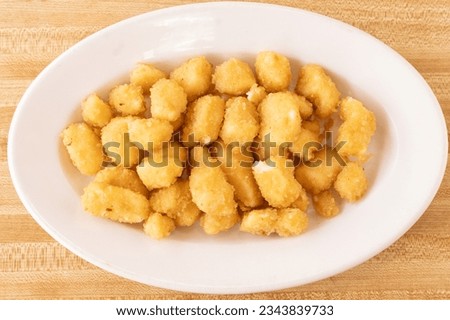 Deep fried cheese curds on a plate
