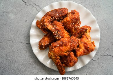 Deep Fried Chicken Wing With Hot And Spicy Sauce In Korean Style Or Asian Food Concept.