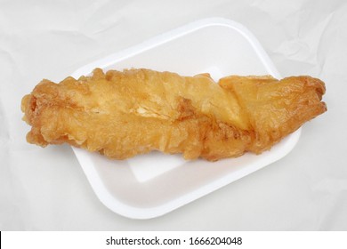 Deep Fried Cod In Batter From A British Fish And Chips Takeaway