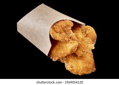 Deep Fried Cod In A Paper Bag. Delicious Fish Food. Black Isolate.