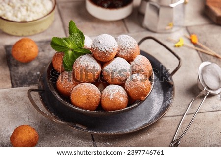 Deep fried cottage heese balls. Freshly baked sweet croquettes, served sugar powder. Delicious homemade dessert.