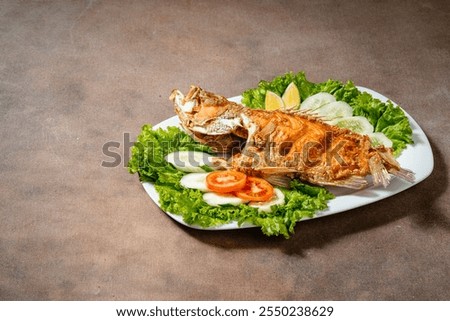 Deep fried crispy grouper fish with sambal dabu dabu