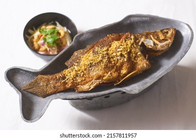 Deep Fried Fish Topped With Fried Garlic Served With A Side Of Green Salad And Fish Sauce, Asian Fish Dish, Dining, Slice, Protein, Cholesterol, Freshness, Fried Food Top View, Vegetable