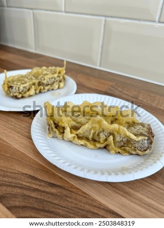 Similar – Image, Stock Photo Serving of battered and fried chicken drumsticks