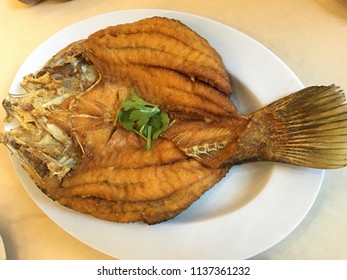 Deep Fried Seabass Fish Or Giant Sea Perch In Black Soy Sauce.