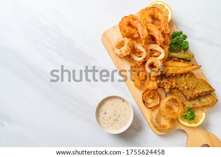 deep fried seafood (shrimps and squid) with mix vegetable - unhealthy food style