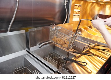 Deep Fryer With Boiling Oil On Restaurant Kitchen