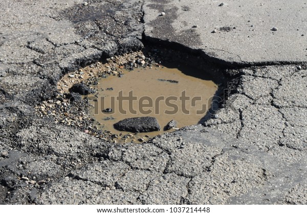 Deep Hazardous Water Filled Pothole Road Stock Photo 1037214448 ...