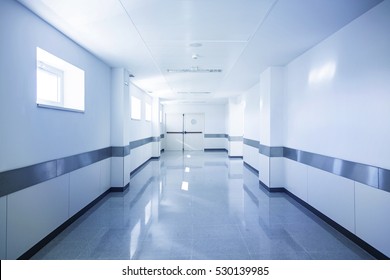 Deep hospital corridor, detail of a white corridor in a hospital, architecture and health