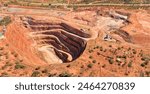 Deep open pit copper ore mine in Cobar town of NSW, Australia - aerial top down view.