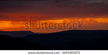 Deep Orange Sunset Below A Storm And Above The Never Summer Mountains in Rocky Mountain National Park