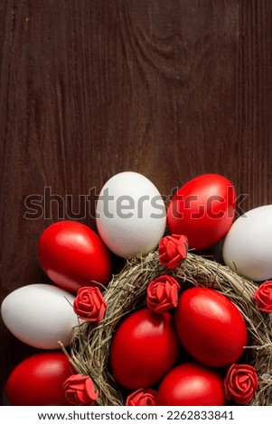 deep red Easter eggs in nest top view background, selective focus image. Happy Easter card
