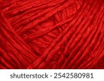 Deep red wool yarn texture suitable as background concept