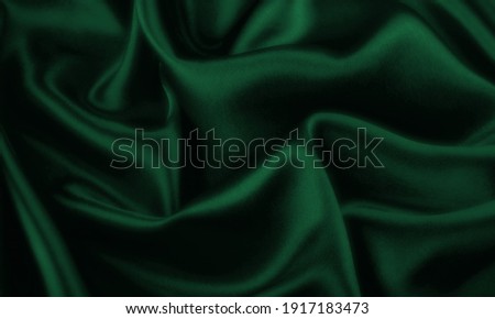 Deep, rich, emerald colored green satin fabric