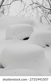 Deep Snow Covering Ground Objects Creating Smooth Rounded Shapes. Minimalist Winter Landscape In A White Park.