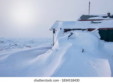 Deep Snowdrifts Piled High Against The Side Of A House After A Winter Storm In Churchill, Manitoba, Canada.