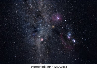 Deep space image containing constellations Orion, Monoceros, Gemini and many bright nebulae and star clusters