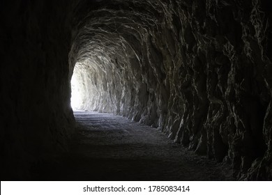 Deep stone tunnel, detail of ancient cave on a mountain