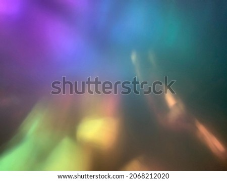 Deep teal, purple, yellow, orange multi chrome color shift look blurred background or overlay for vintage feel