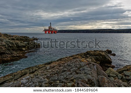 Deep water drill rig is moored near shore after finishing an exploration well, Newfoundland and Labrador, Canada.