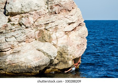 Deep Water Solo Climber Trying A New Route Directly From The Water