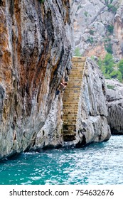 Deep Water Solo. Climbing Over The Sea. Adventure Climbing.