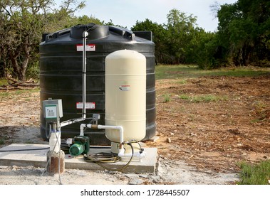 Deep Water Well Set Up, Country Side Construction. Drilled Draw Well With Pressure Switch And Storage Tank.