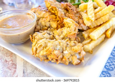 deep-fried fish steaks with almond flakes and friend fried - Powered by Shutterstock