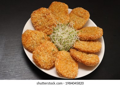 Deep-fried Prawn Cutlets On Black Background