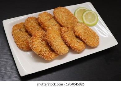 Deep-fried Prawn Cutlets On Black Background