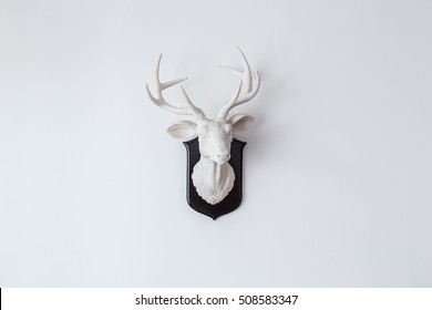 Deer Head Sculpture On White Wall