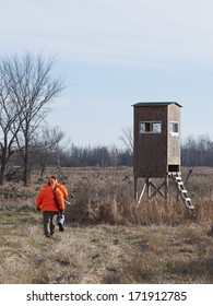 Deer Hunters And A Deer Stand