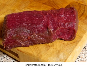 Deer Sirloin On Wooden Cutting Board