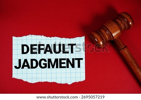 Default Judgment text written on rip paper with wooden judgment gavel on red background