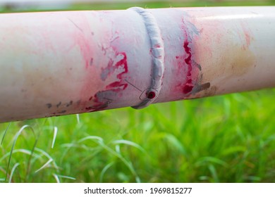 Defect colour red round indication butt weld pipe oil found by penetrant test. - Shutterstock ID 1969815277
