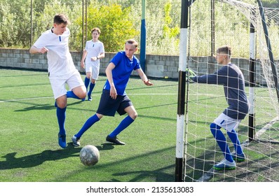 Defender Tackles The Ball In The Penalty Area. Soccer Game