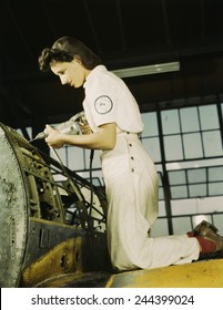 Defense Worker Riveting As Part Of Her Training To Become A Mechanic At The Naval Air Base, In Corpus Christi, Texas. August 1942.