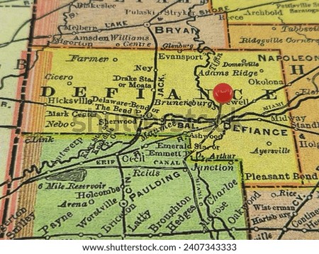 Defiance County, Ohio marked by a red tack on a colorful vintage map. The county seat is located in the city of Defiance, OH.