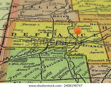 Defiance County, Ohio marked by an orange tack on a colorful vintage map. The county seat is located in the city of Defiance, OH.