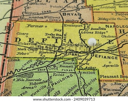 Defiance County, Ohio marked by a white tack on a colorful vintage map. The county seat is located in the city of Defiance, OH.