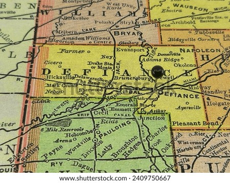 Defiance County, Ohio marked by a black tack on a colorful vintage map. The county seat is located in the city of Defiance, OH.