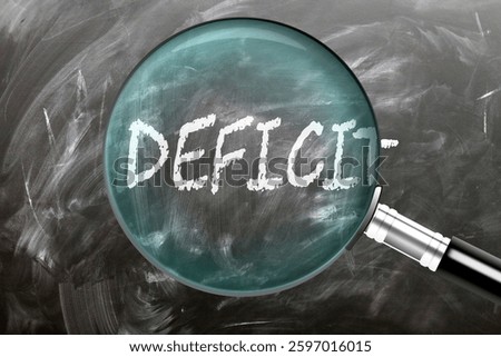Deficit - learn, study and inspect it. Taking a closer look at deficit. A magnifying glass enlarging word 'deficit' written on a blackboard