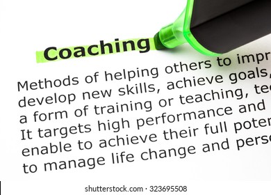 Definition of the word Coaching printed on paper and highlighted with green text marker. - Powered by Shutterstock