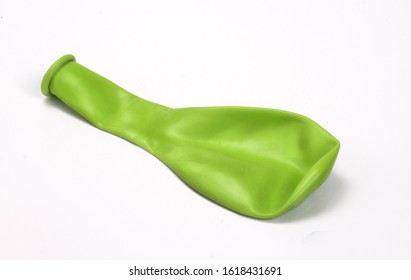 Deflated Green Balloon Isolated On White Background.