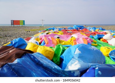 A Deflated Inflatable Attraction Lies On The Ground