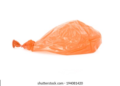 Deflated Orange Balloon Isolated Over White Background